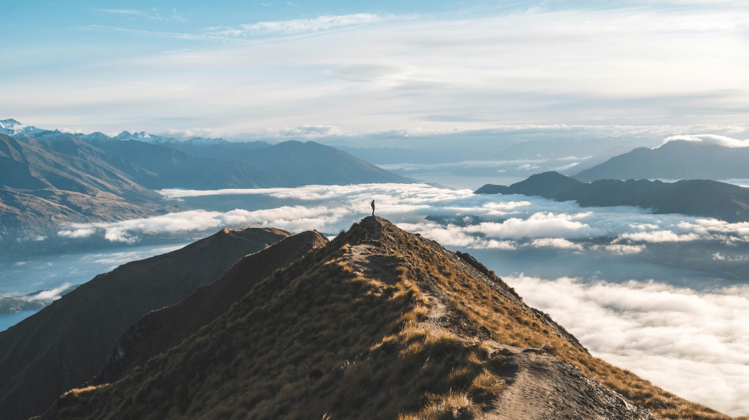 Mount Roy above the clouds. Photo by Sander Lenaerts on Unsplash